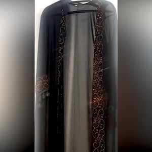 black abaya, kaftan with gold crystal designs going down an around the sleeves
